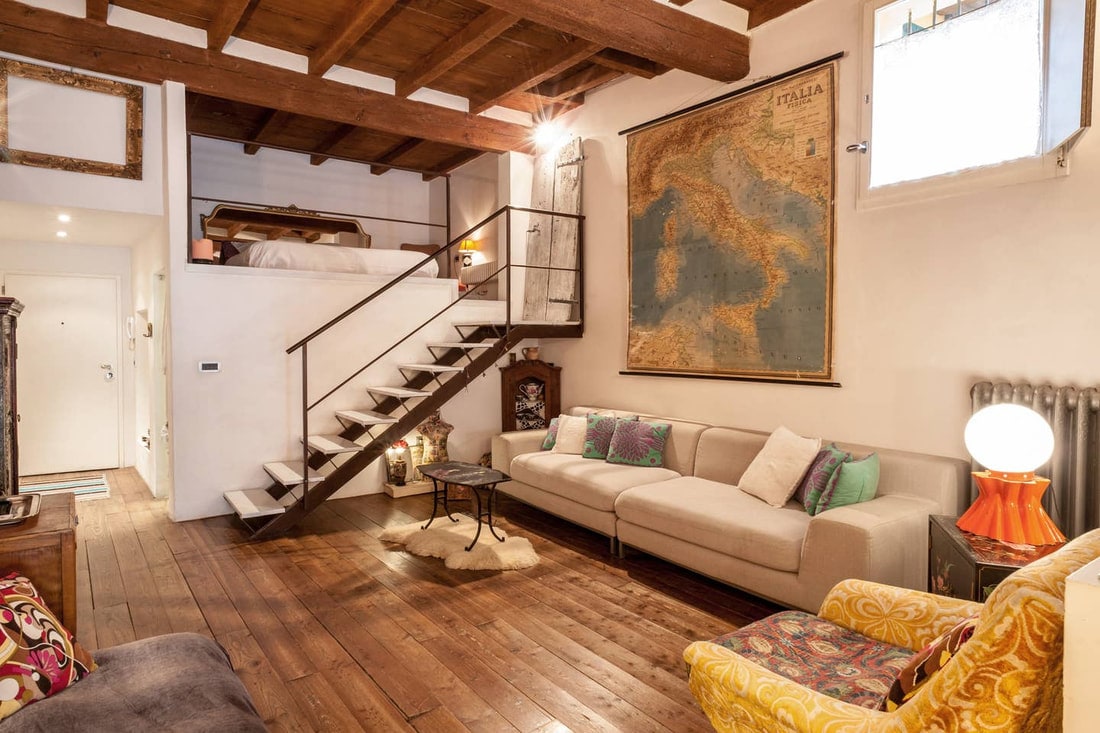 Best Airbnb in Bologna - sofa with map