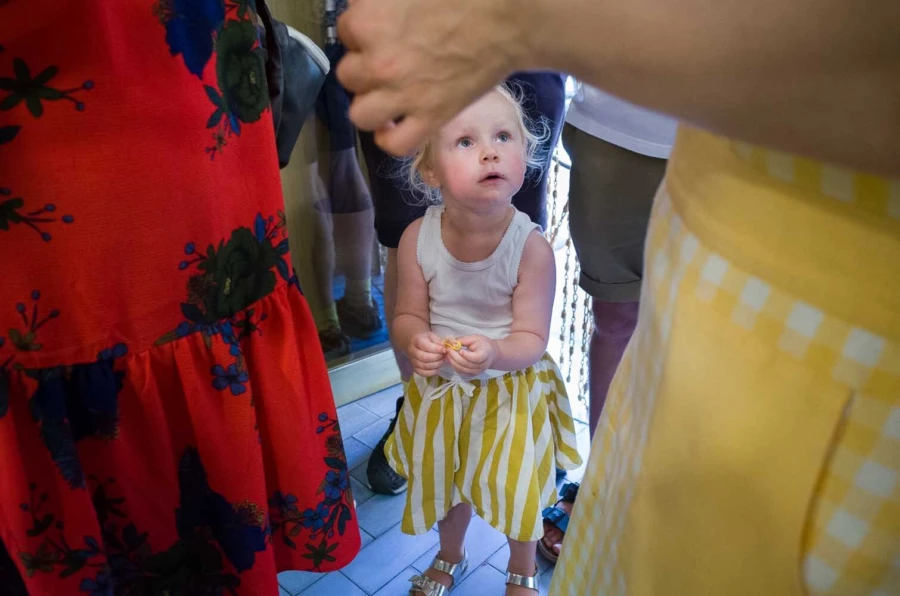 A young kid making tortellini during a food tour in Bologna