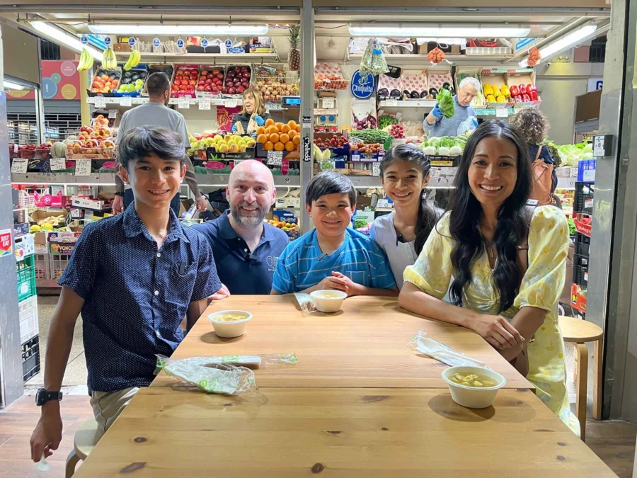 Actress Jessica Ray and her family in a Bologna food market